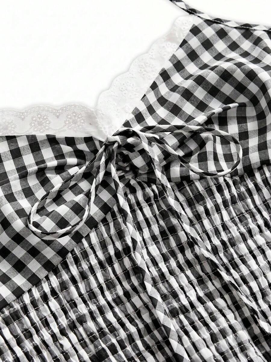 Black plaid halter crop tank top for women featuring a bow detail and slim fit design.
