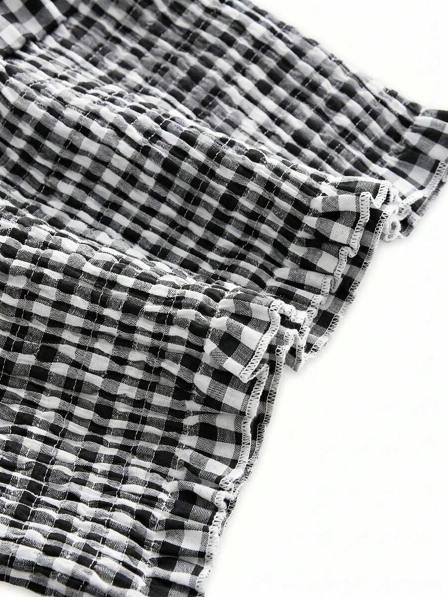Black plaid halter crop tank top for women featuring a bow detail and slim fit design.
