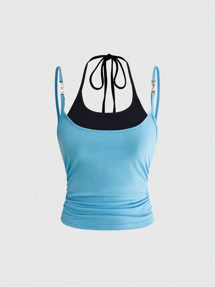 Black halter crop tank top featuring lace-up front details, ruched texture, eye appliques, and matching detached arm sleeves.