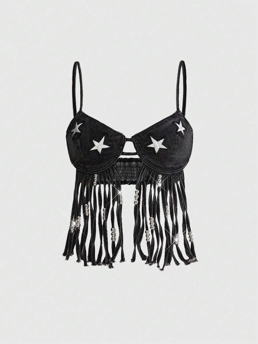 Blue denim camisole top for women featuring star patch detailing, fringe tassel asymmetrical hem, and spaghetti straps.