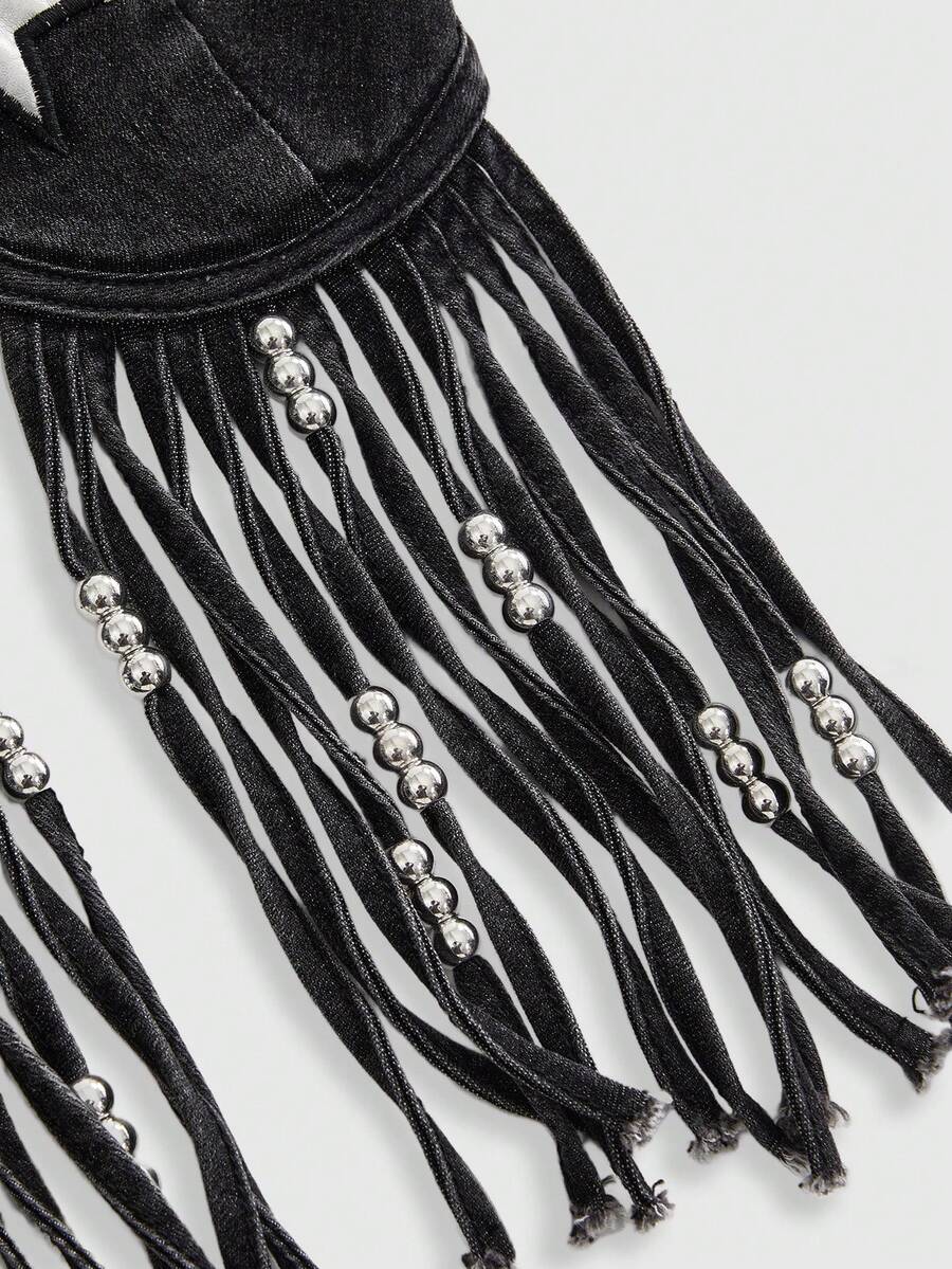Blue denim camisole top for women featuring star patch detailing, fringe tassel asymmetrical hem, and spaghetti straps.