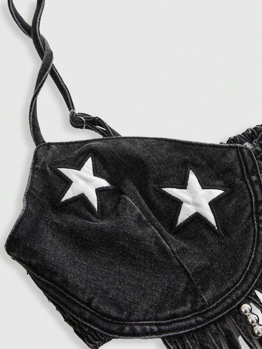 Blue denim camisole top for women featuring star patch detailing, fringe tassel asymmetrical hem, and spaghetti straps.