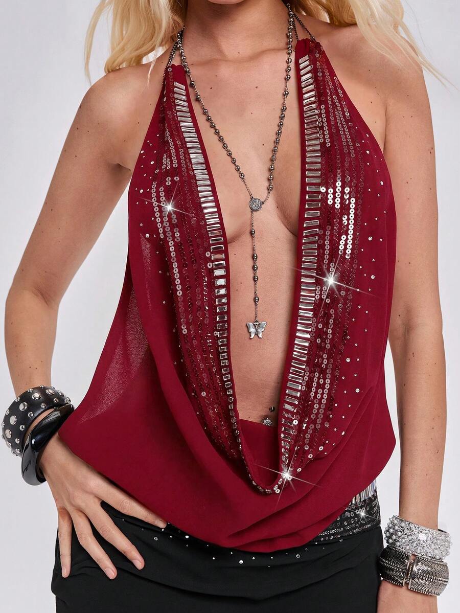 Women wearing a black Y2K draped halter neck backless sequin crop top crafted from semi-sheer chiffon fabric.