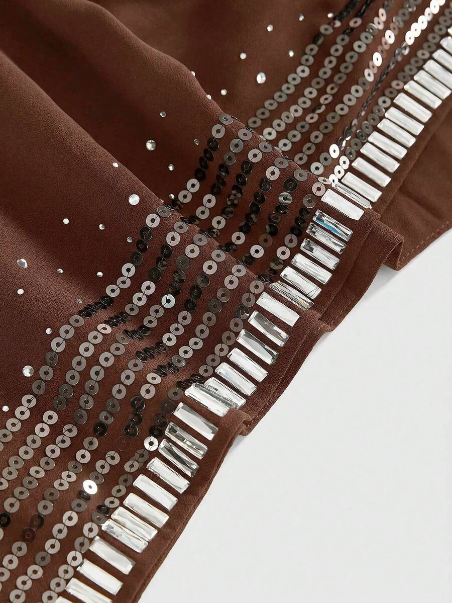 Women wearing a black Y2K draped halter neck backless sequin crop top crafted from semi-sheer chiffon fabric.