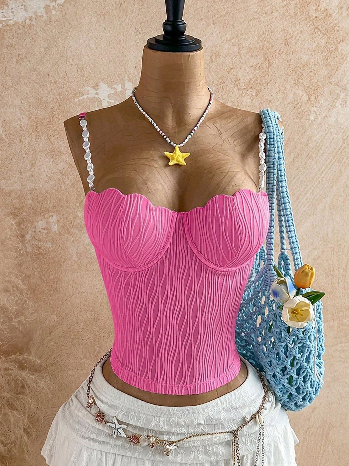 Women's black molded cup camisole top with scallop detailing and spaghetti straps.