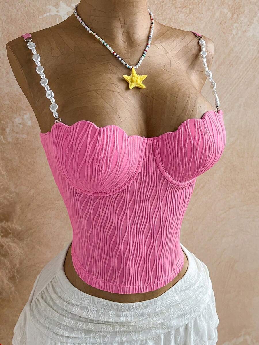 Women's black molded cup camisole top with scallop detailing and spaghetti straps.