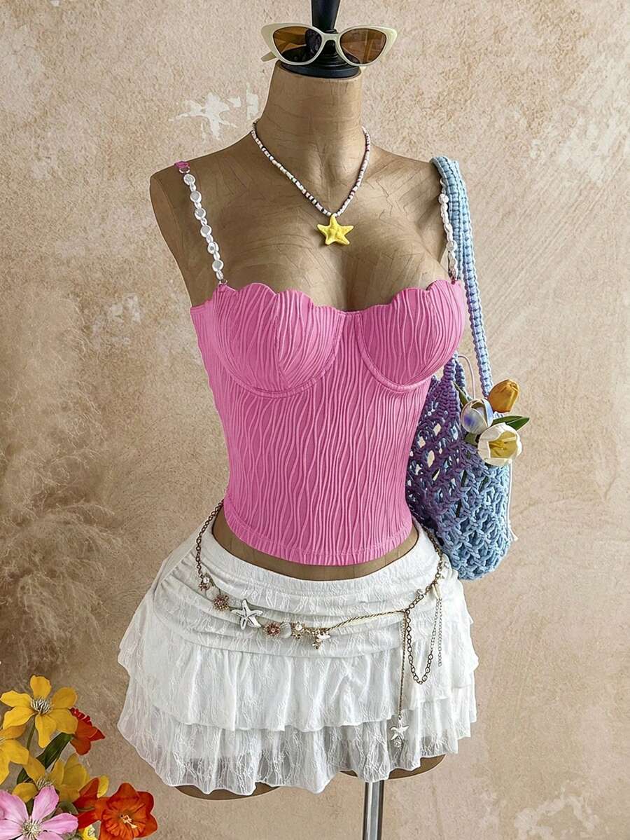Women's black molded cup camisole top with scallop detailing and spaghetti straps.