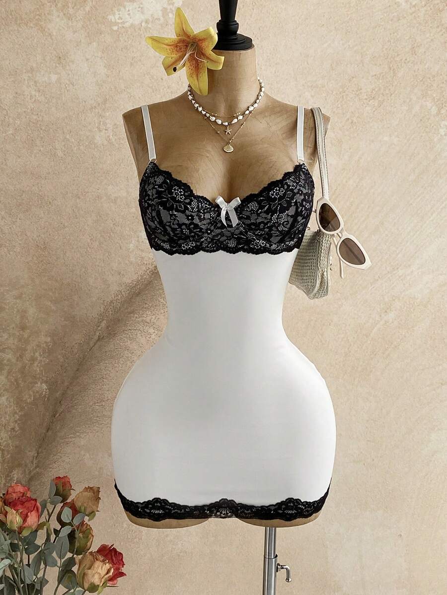 Women's black mesh bodycon mini dress featuring spaghetti straps, contrast lace cup details, backless styling, and a slim fit.
