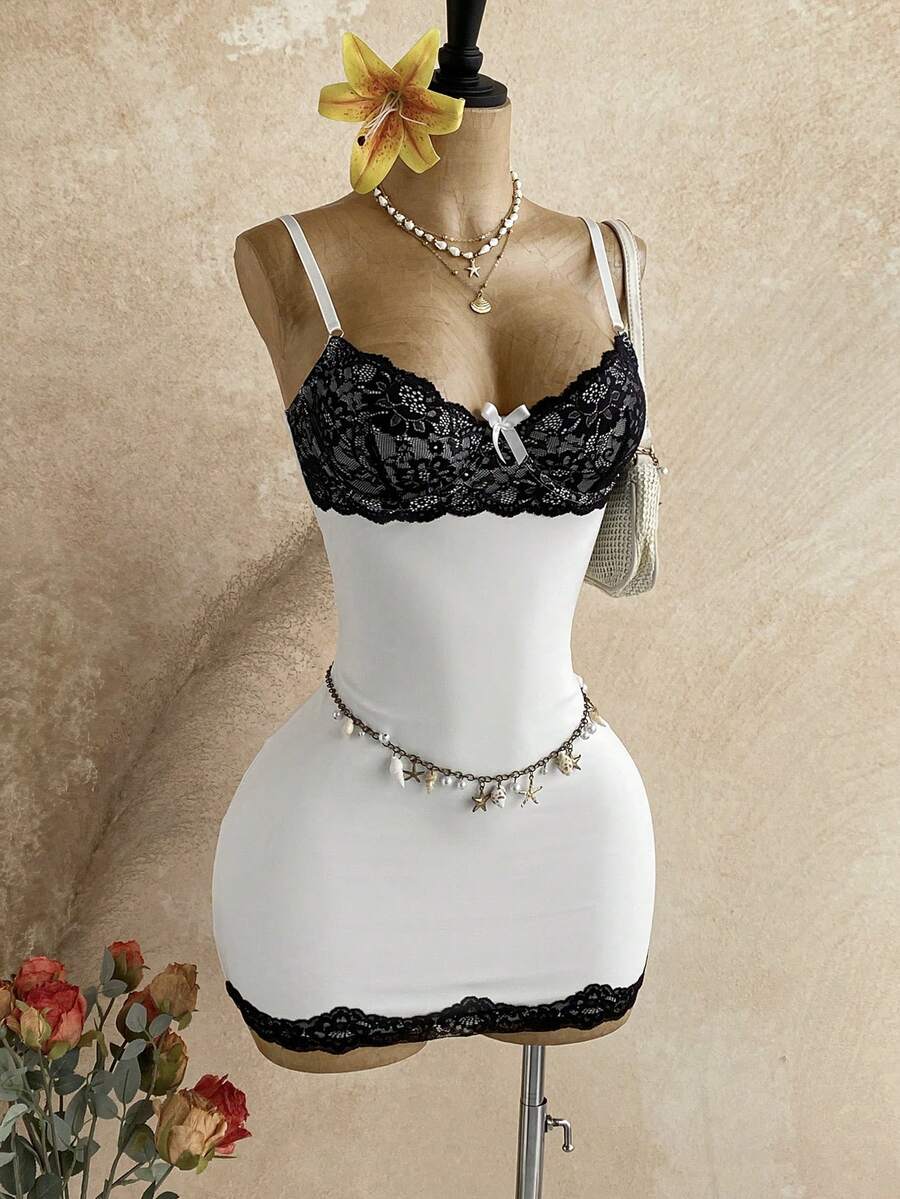 Women's black mesh bodycon mini dress featuring spaghetti straps, contrast lace cup details, backless styling, and a slim fit.