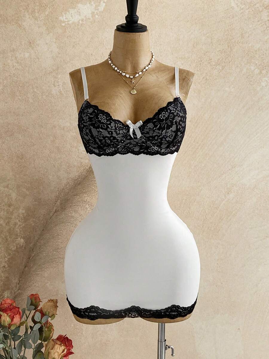 Women's black mesh bodycon mini dress featuring spaghetti straps, contrast lace cup details, backless styling, and a slim fit.