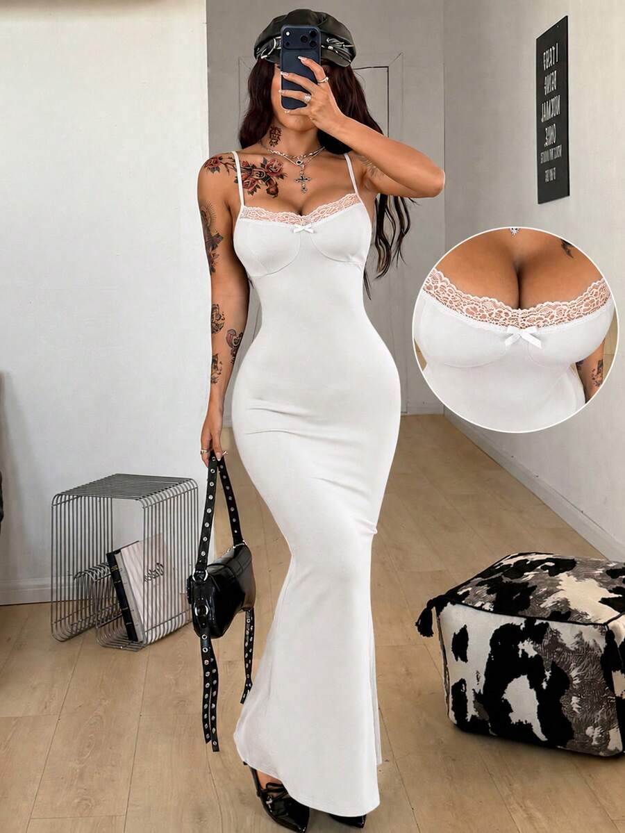 Black backless cami midi dress for women featuring spaghetti straps, slim fit mermaid silhouette, backless button detail, and high stretch knitted fabric.
