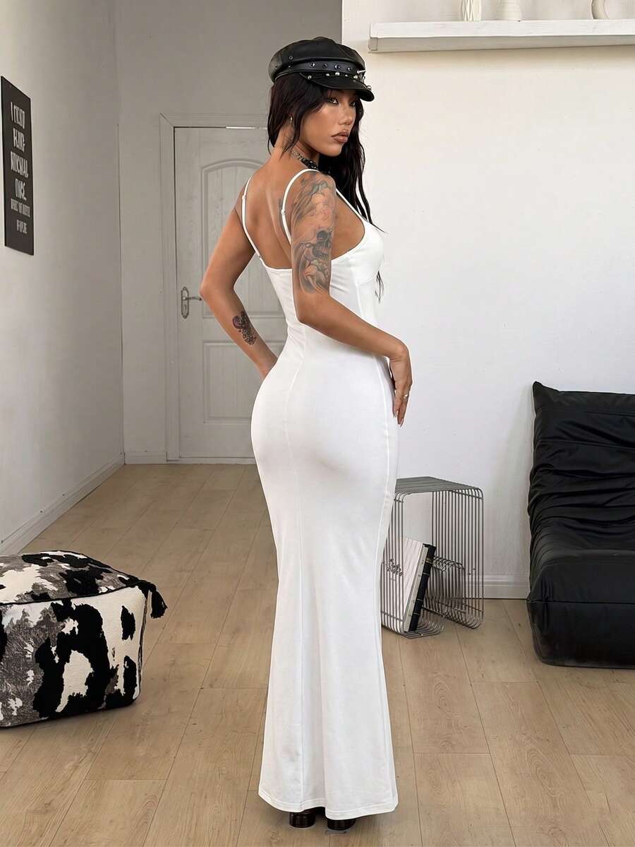 Black backless cami midi dress for women featuring spaghetti straps, slim fit mermaid silhouette, backless button detail, and high stretch knitted fabric.