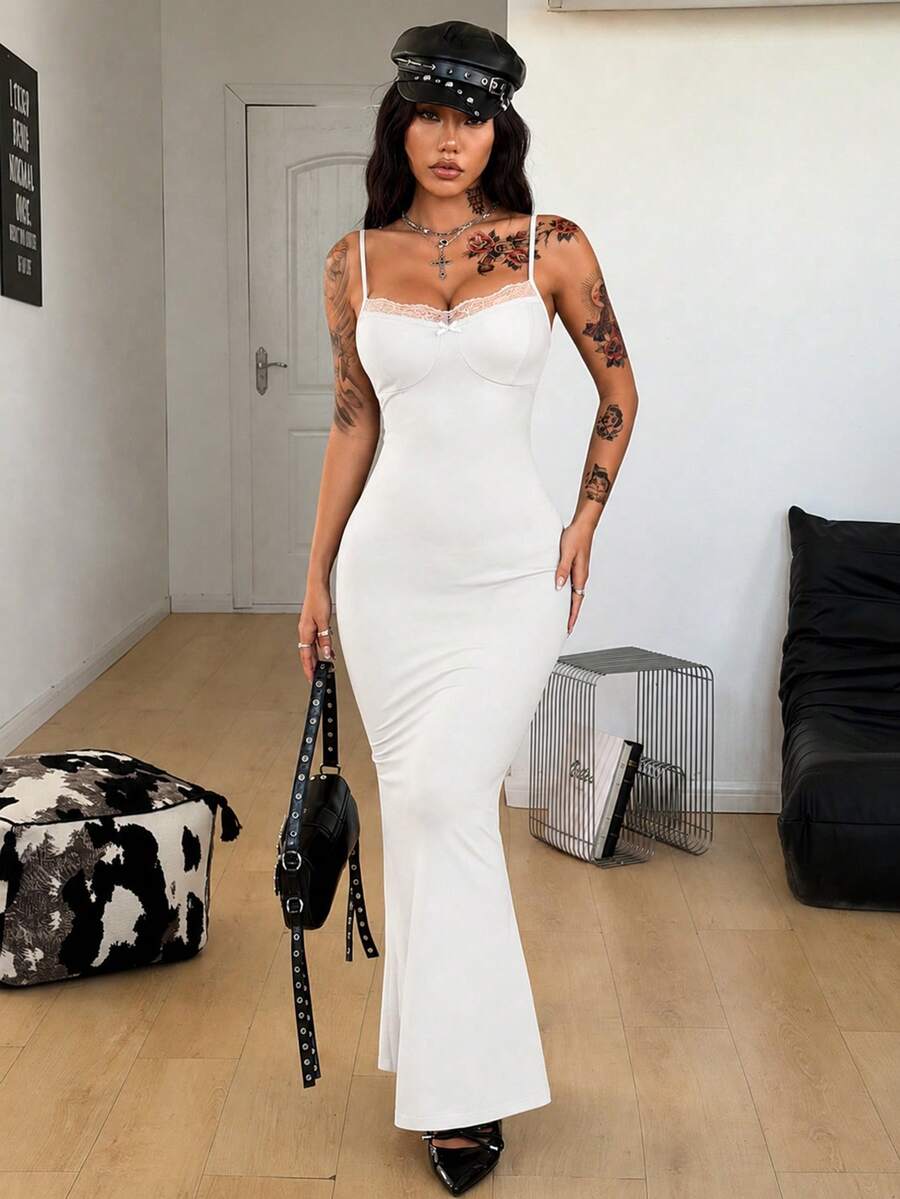 Black backless cami midi dress for women featuring spaghetti straps, slim fit mermaid silhouette, backless button detail, and high stretch knitted fabric.