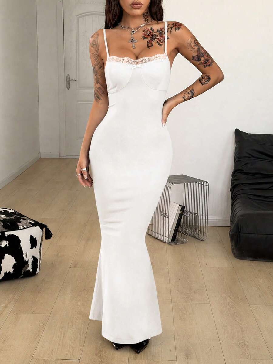 Black backless cami midi dress for women featuring spaghetti straps, slim fit mermaid silhouette, backless button detail, and high stretch knitted fabric.