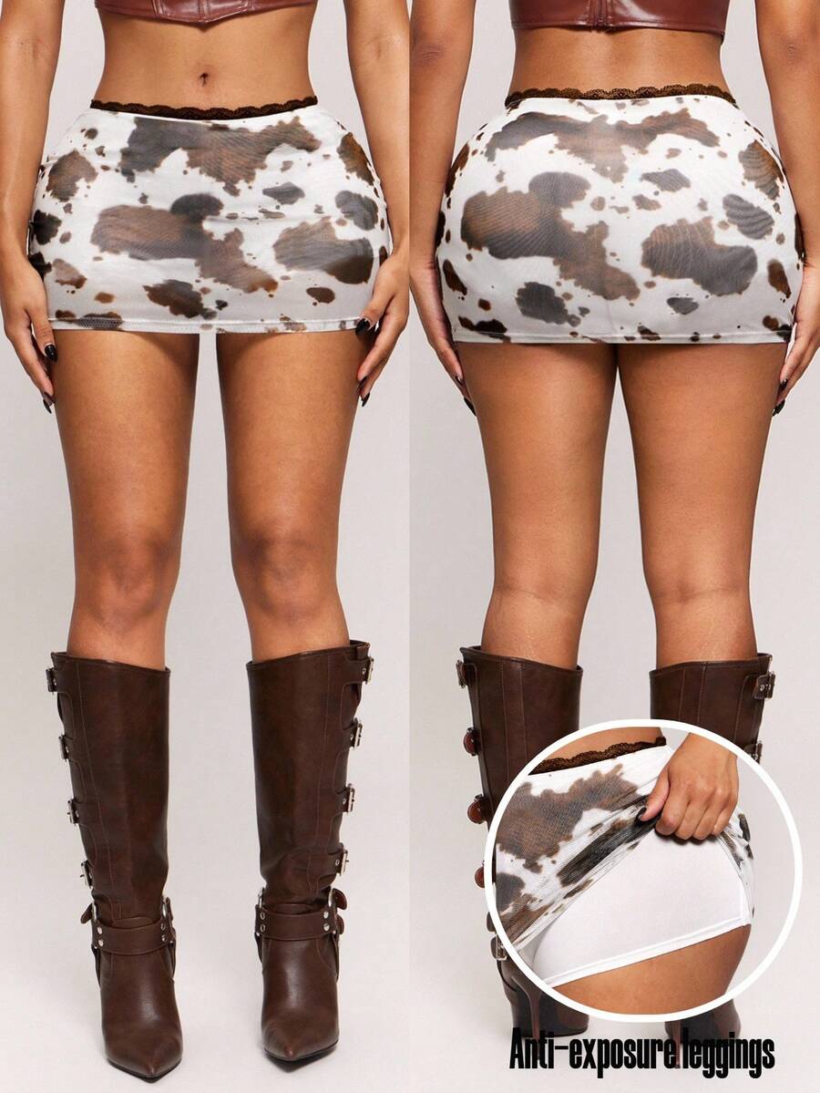 Women's black bodycon mini skort featuring a low waist, pleated side split hem, zipper closure, and built-in shorts.