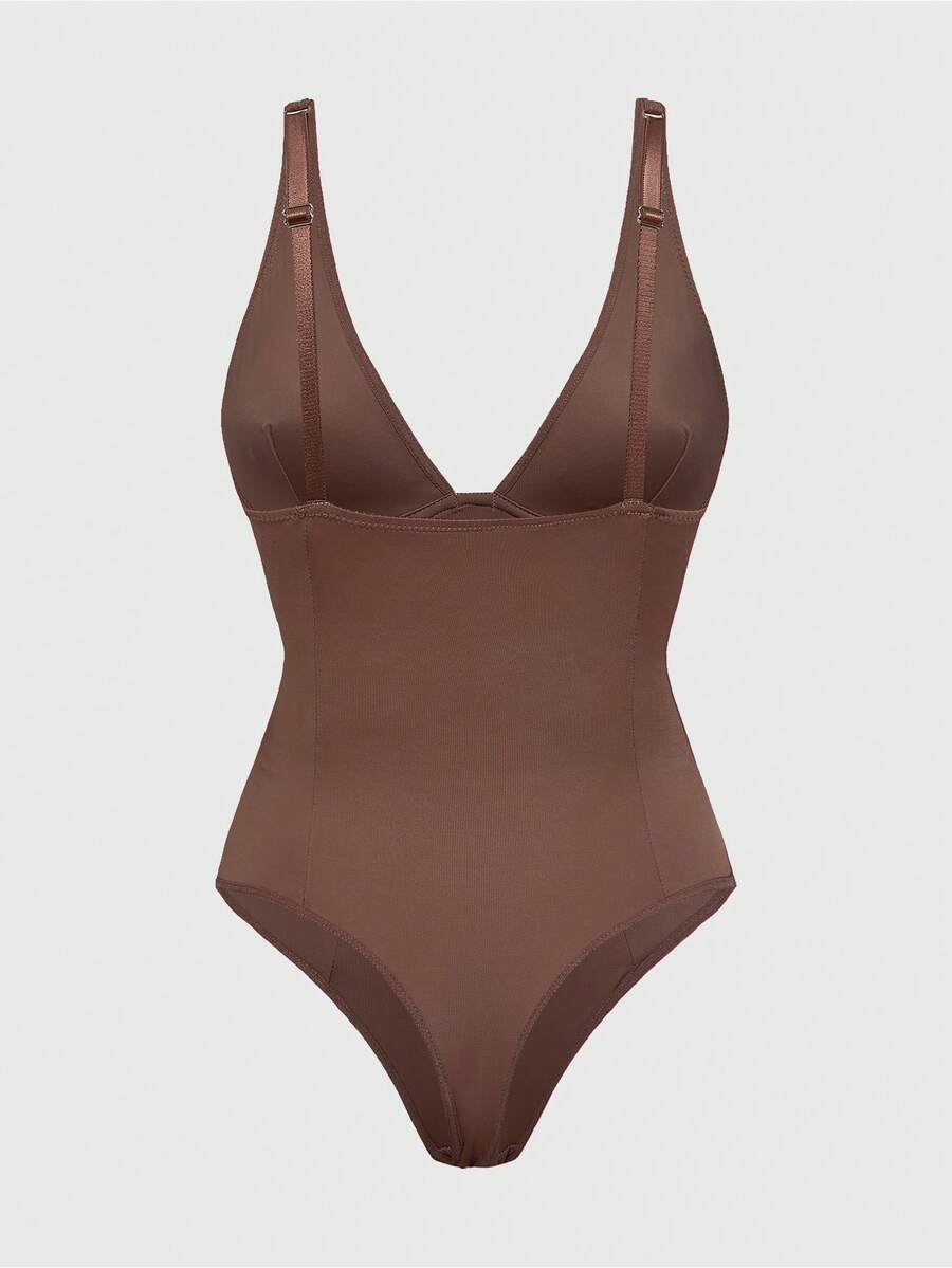 Apricot backless shapewear bodysuit with thong cut, cup details, and high-stretch fabric for light tummy support.