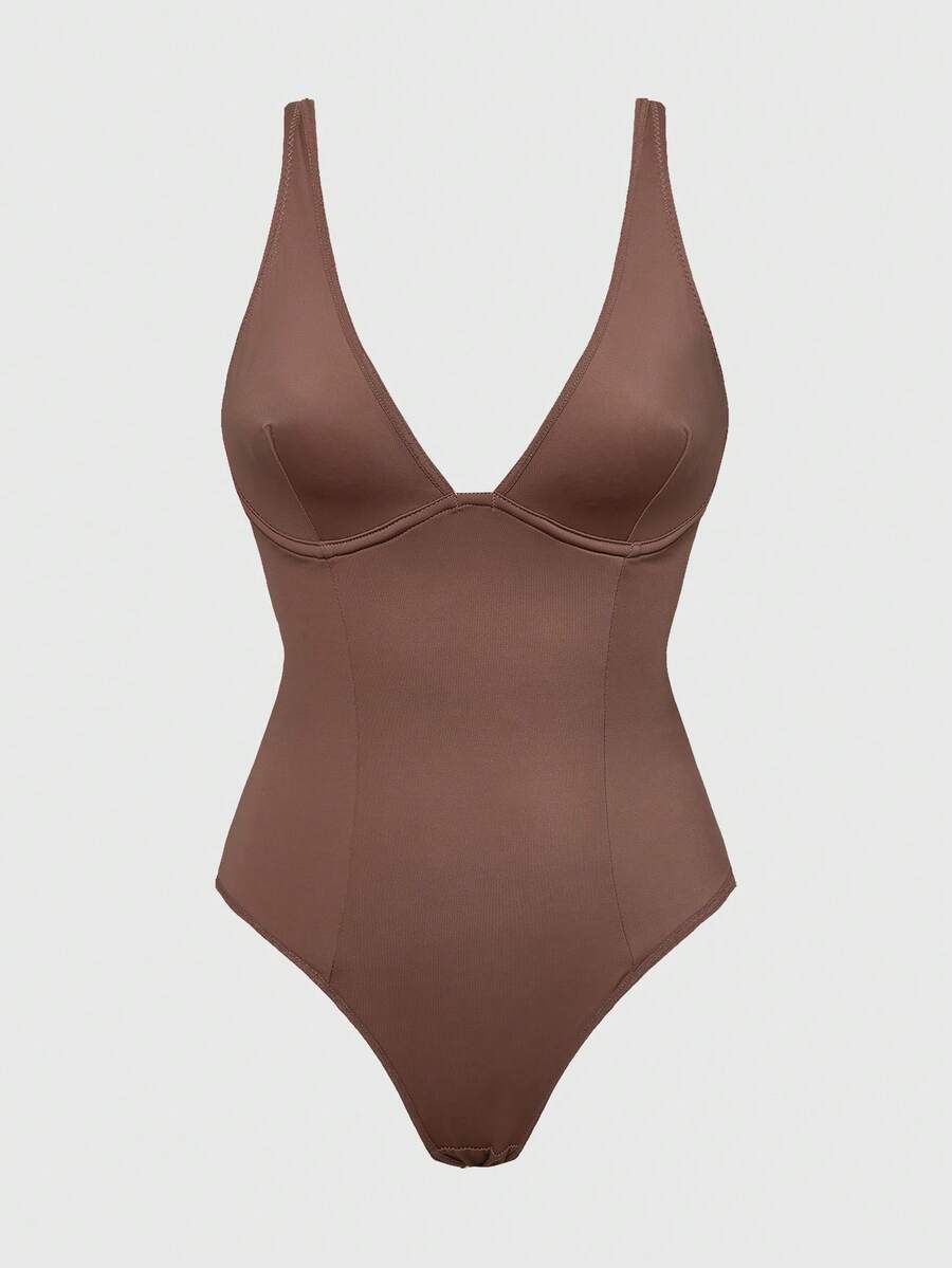 Apricot backless shapewear bodysuit with thong cut, cup details, and high-stretch fabric for light tummy support.