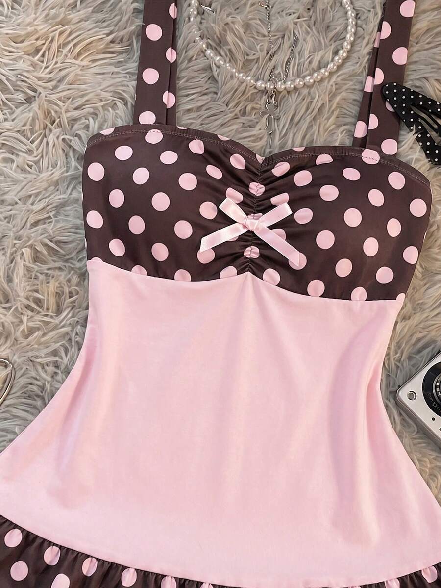 Multicolor women's wide strap tank top featuring polka dot pattern, ruched shirred bodice, and flared ruffle hem.