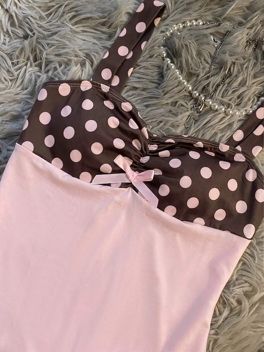 Multicolor women's wide strap tank top featuring polka dot pattern, ruched shirred bodice, and flared ruffle hem.