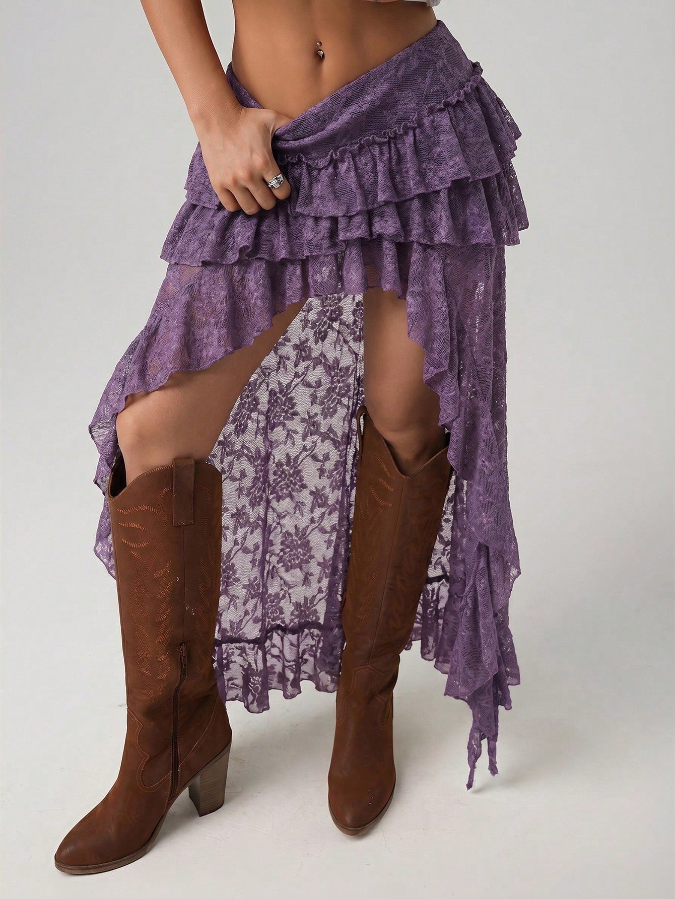 Women's lace tiered asymmetrical maxi skirt featuring a low waist and high slit thigh design.