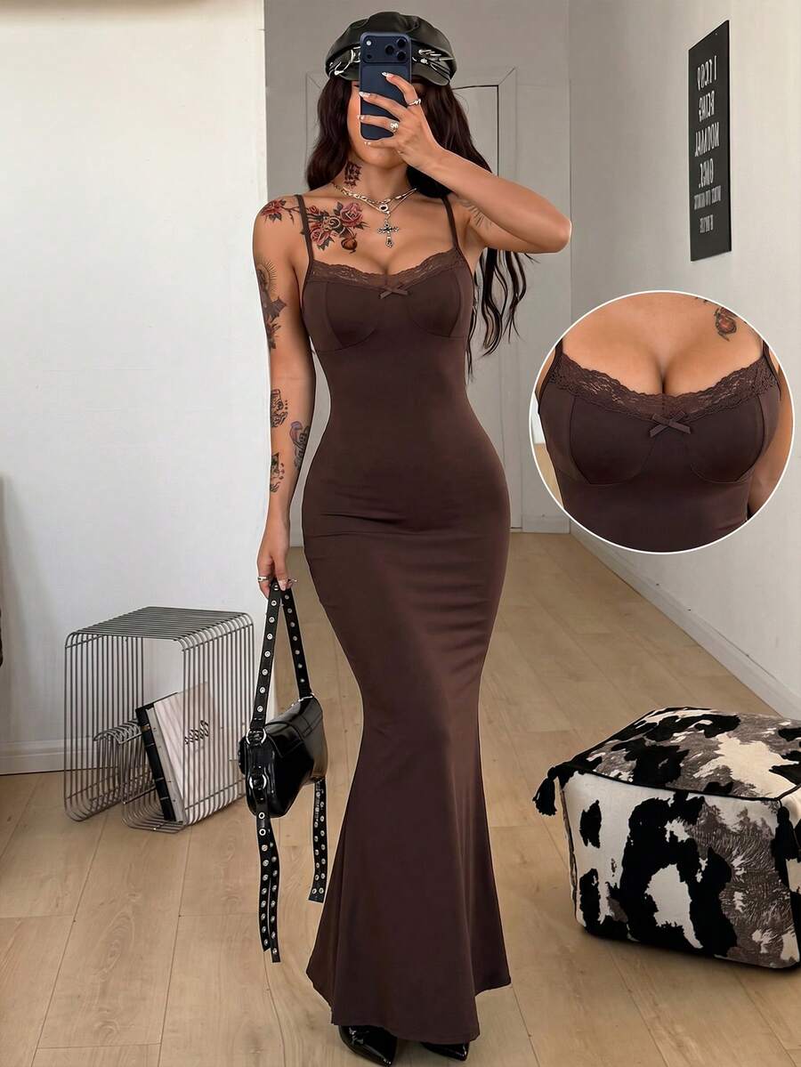 Black backless cami midi dress for women featuring spaghetti straps, slim fit mermaid silhouette, backless button detail, and high stretch knitted fabric.