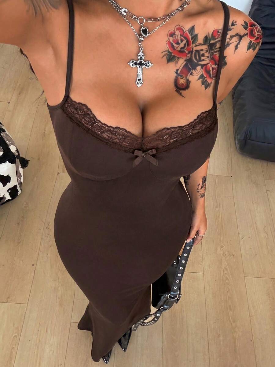 Black backless cami midi dress for women featuring spaghetti straps, slim fit mermaid silhouette, backless button detail, and high stretch knitted fabric.