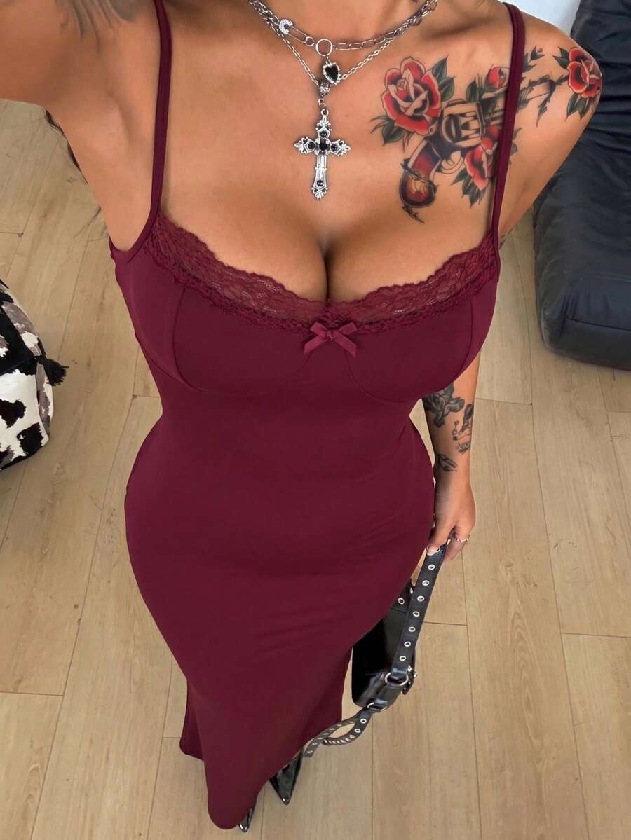 Black backless cami midi dress for women featuring spaghetti straps, slim fit mermaid silhouette, backless button detail, and high stretch knitted fabric.