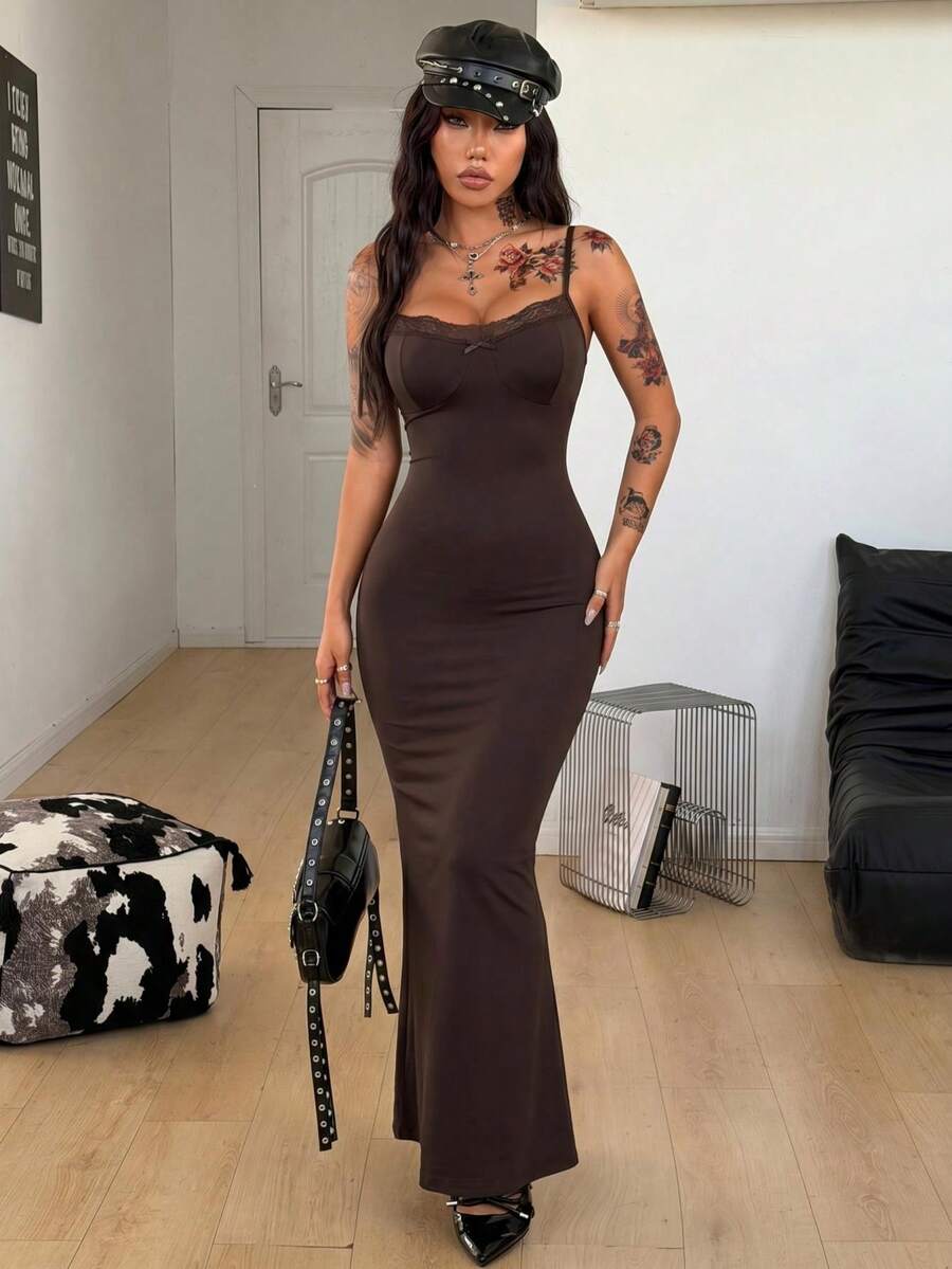 Black backless cami midi dress for women featuring spaghetti straps, slim fit mermaid silhouette, backless button detail, and high stretch knitted fabric.