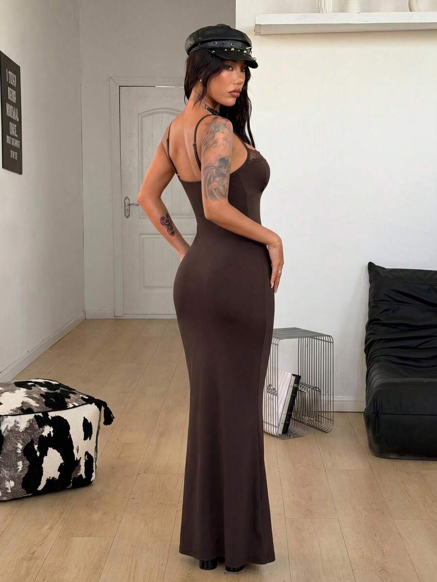 Black backless cami midi dress for women featuring spaghetti straps, slim fit mermaid silhouette, backless button detail, and high stretch knitted fabric.