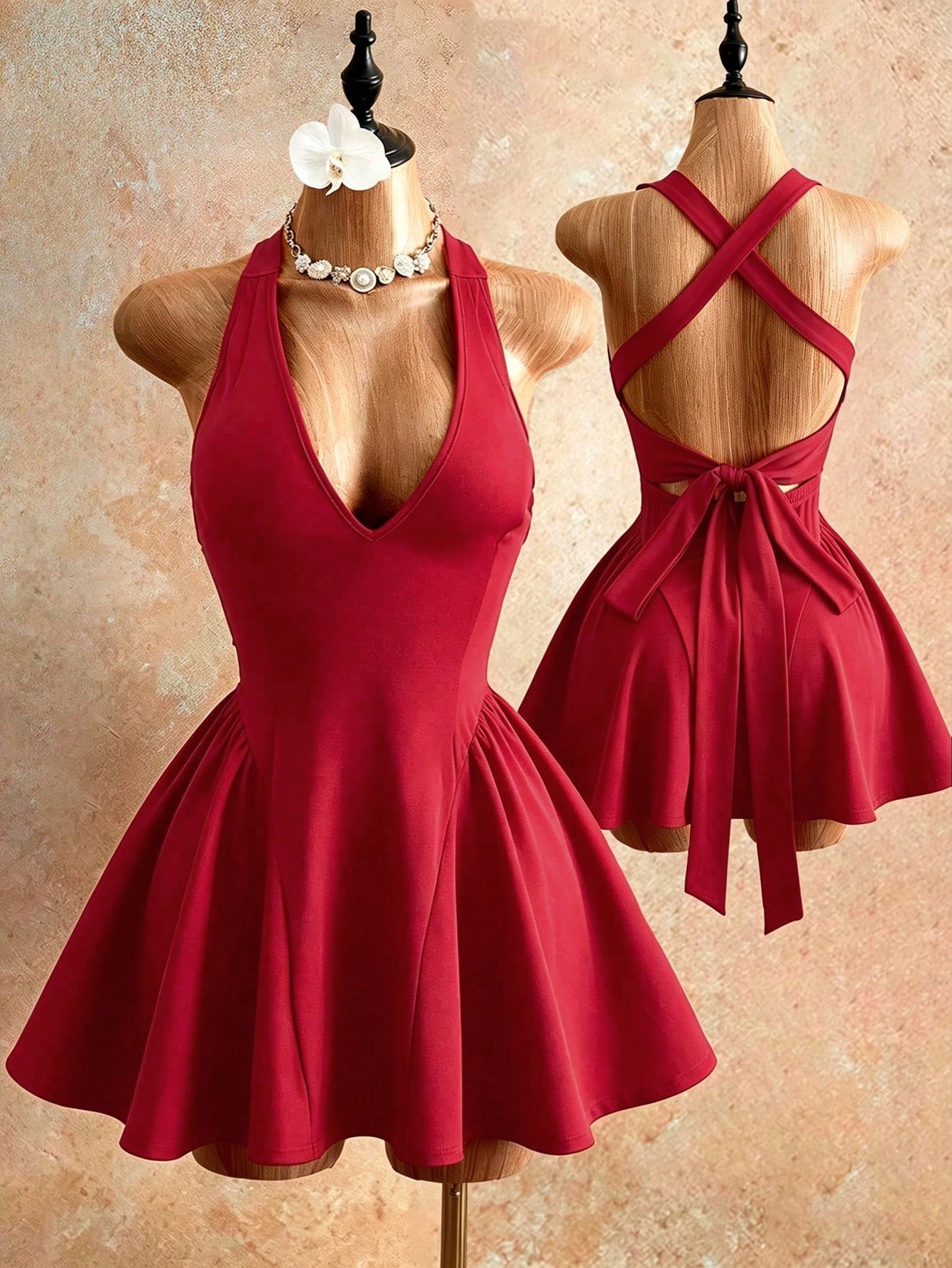 Sleeveless black halter mini dress for women featuring a high waist, A-line flared hem, and criss cross details.