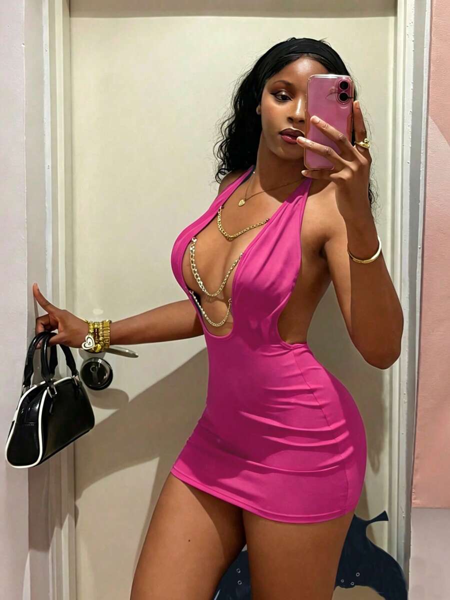 Women's black deep V-neck halter bodycon mini dress featuring a backless design with chain decor detail.