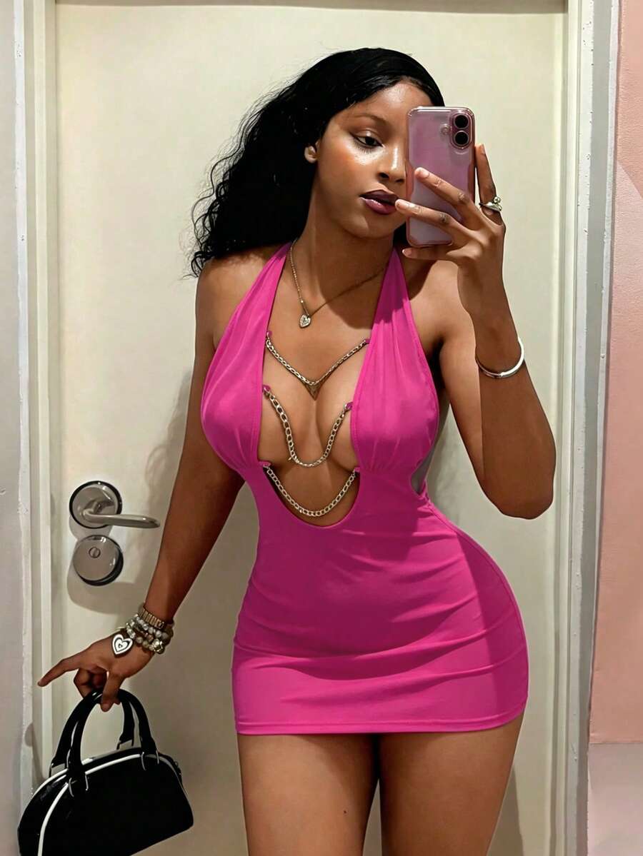 Women's black deep V-neck halter bodycon mini dress featuring a backless design with chain decor detail.