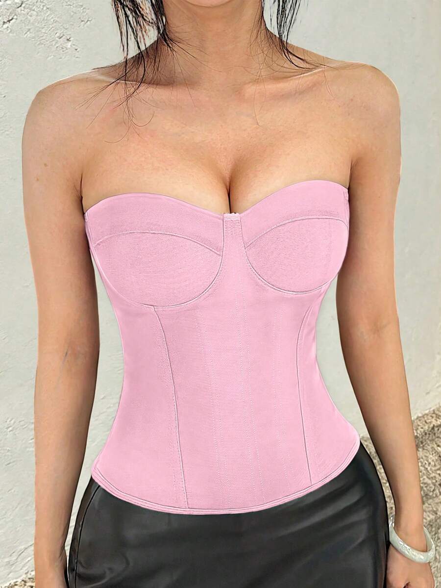 Black strapless corset top with boning, lace-up back, and a cropped slim-fit silhouette for women.