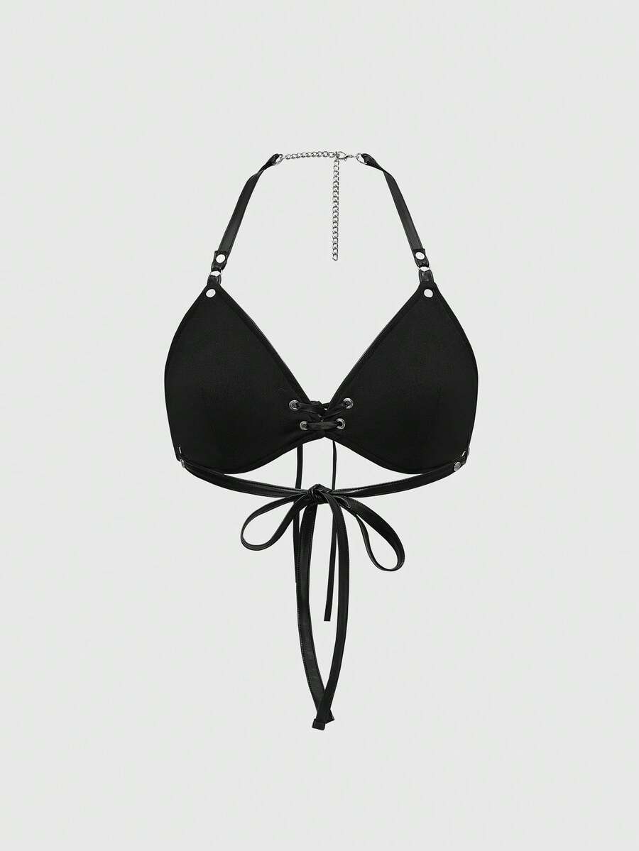 Women wearing a black flame patch PU halter micro crop top featuring a backless lace-up design and matching arm sleeves.