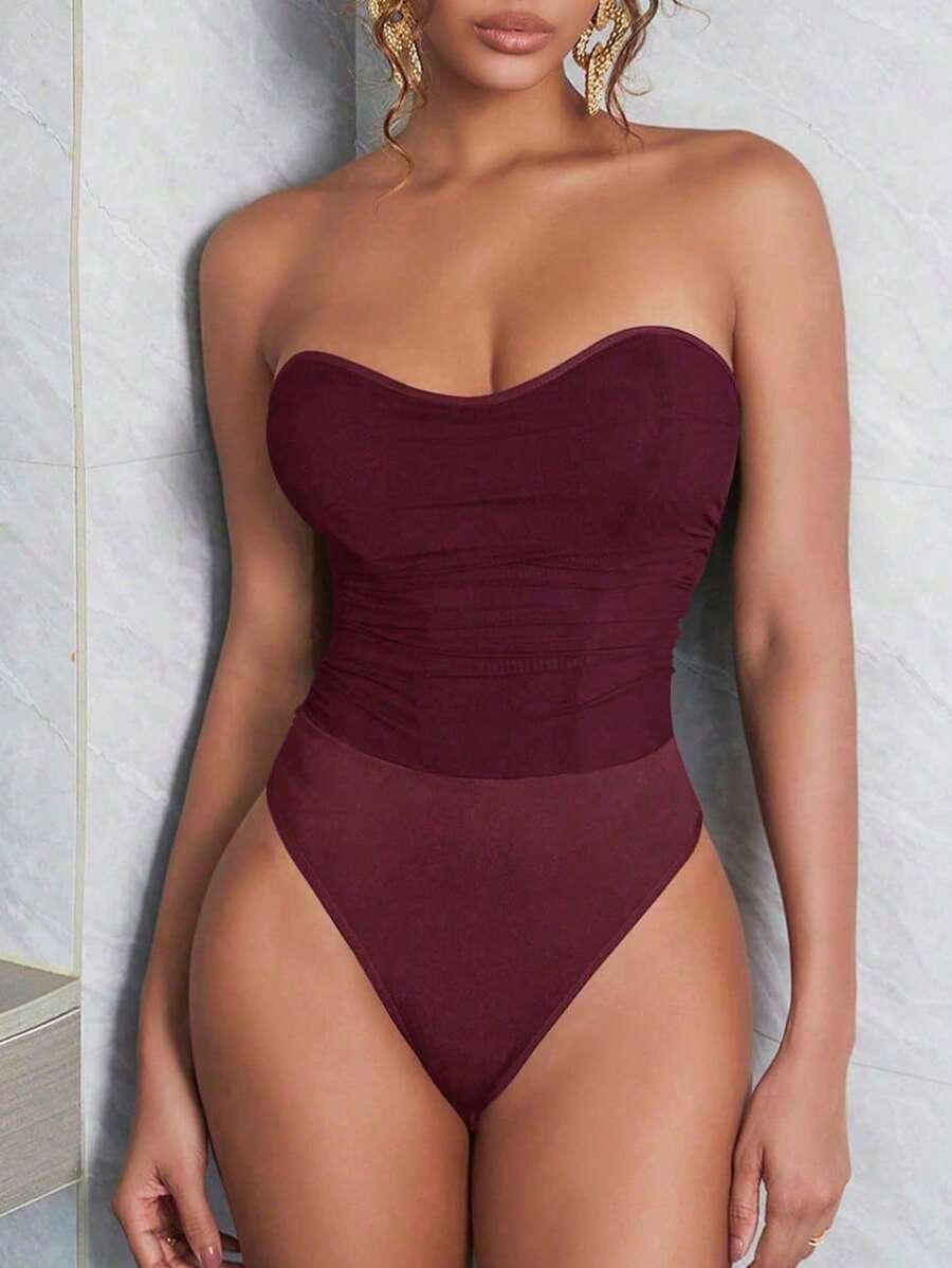 Black mesh ruched tube corset top for women featuring a strapless and backless slim fit design.