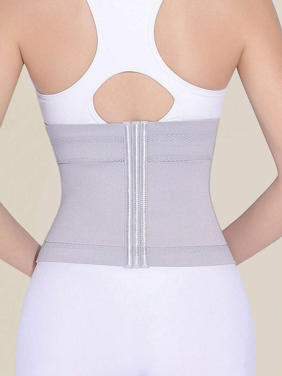 Black double belt wrap waist trainer corset shapewear for women with strong tummy control and button front design.