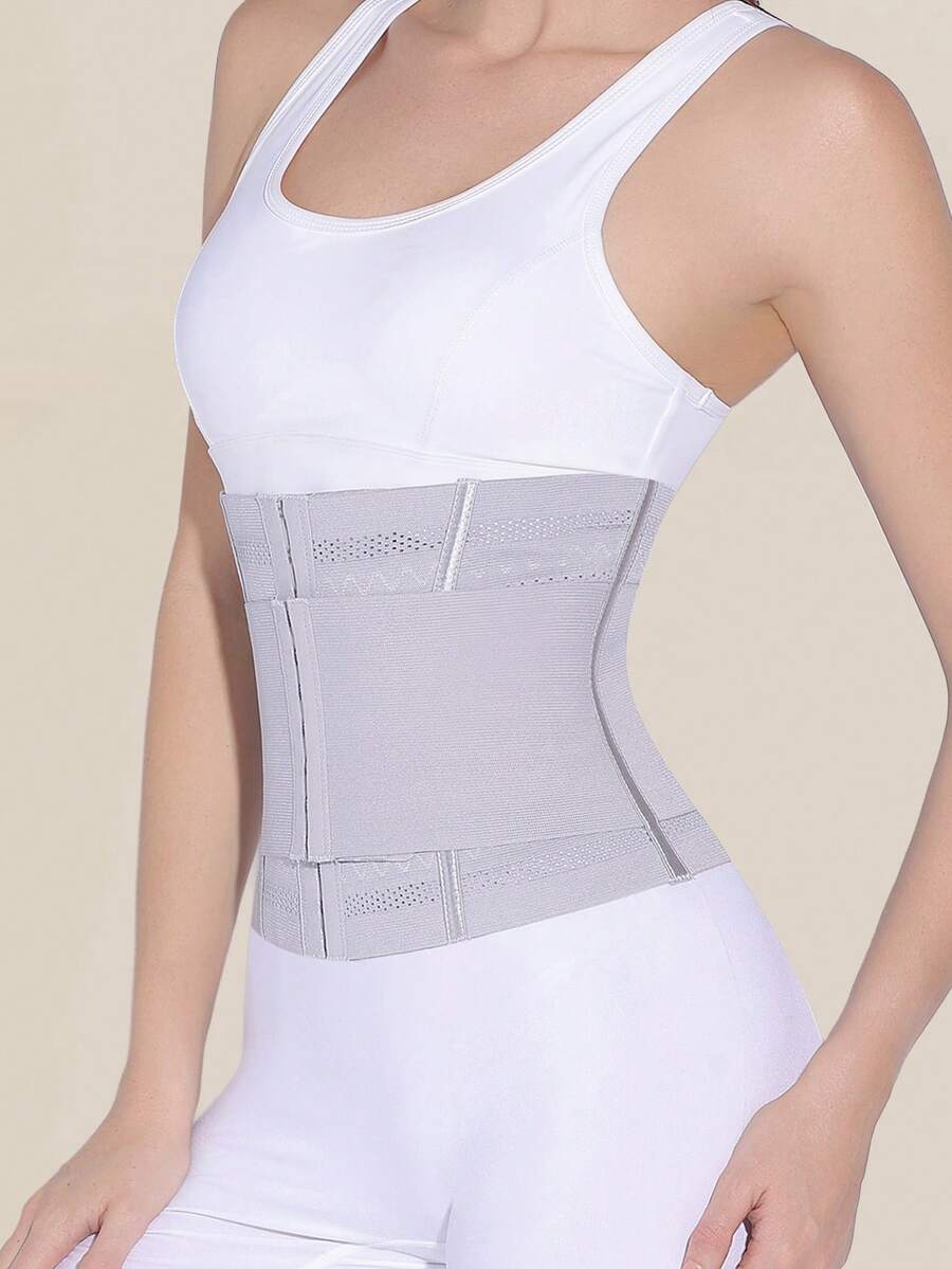 Black double belt wrap waist trainer corset shapewear for women with strong tummy control and button front design.