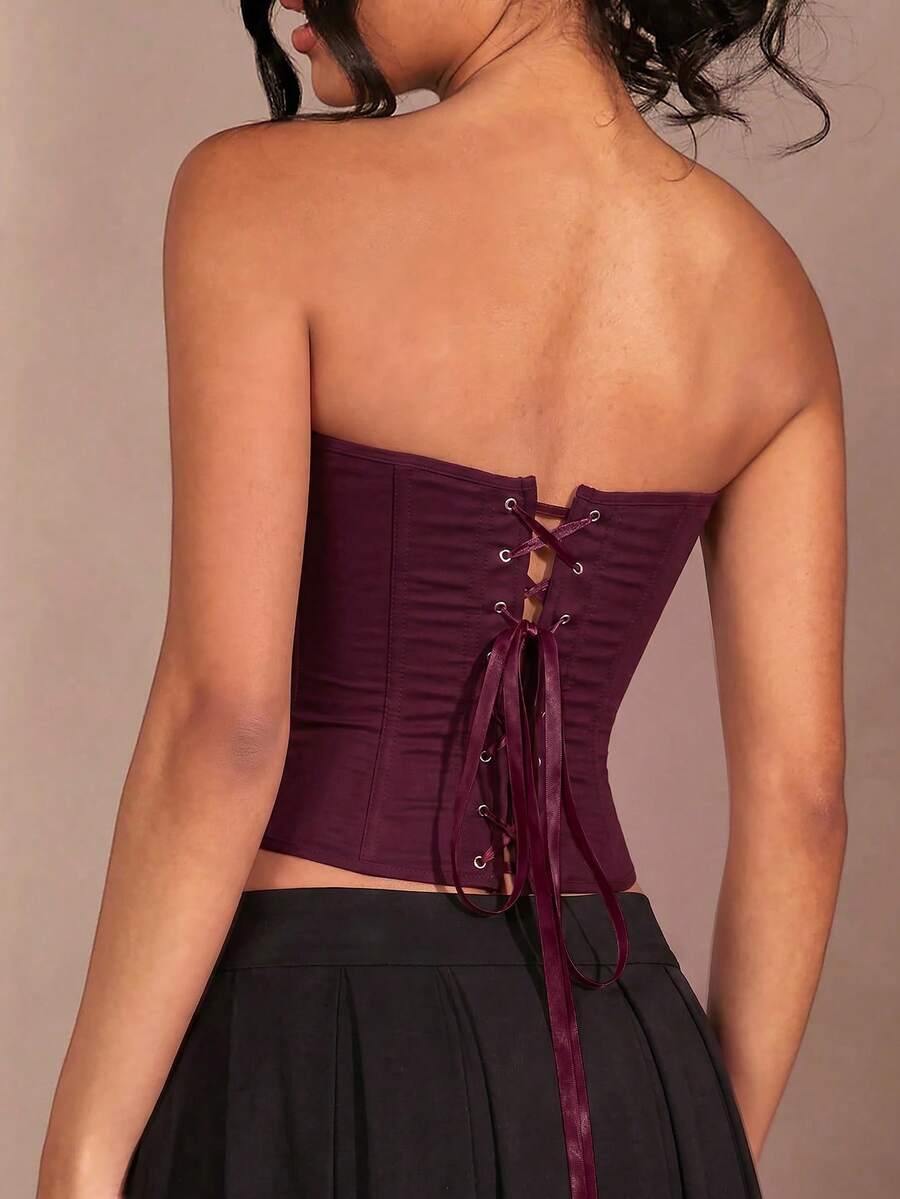 Red strapless corset top with boning and lace-up back, slim fit cropped tube top for women.