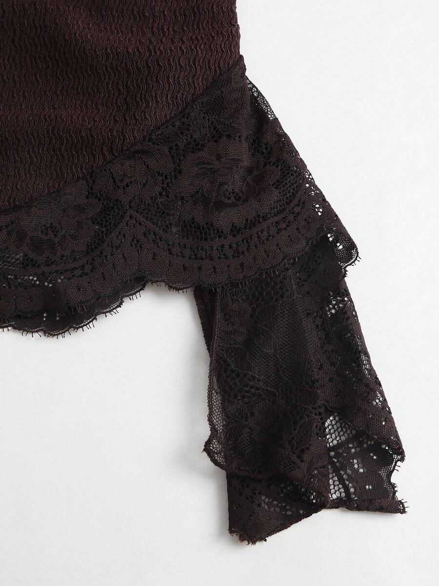 Women's black strapless lace patchwork bodycon mini dress featuring a slim fit design and an asymmetrical hem.