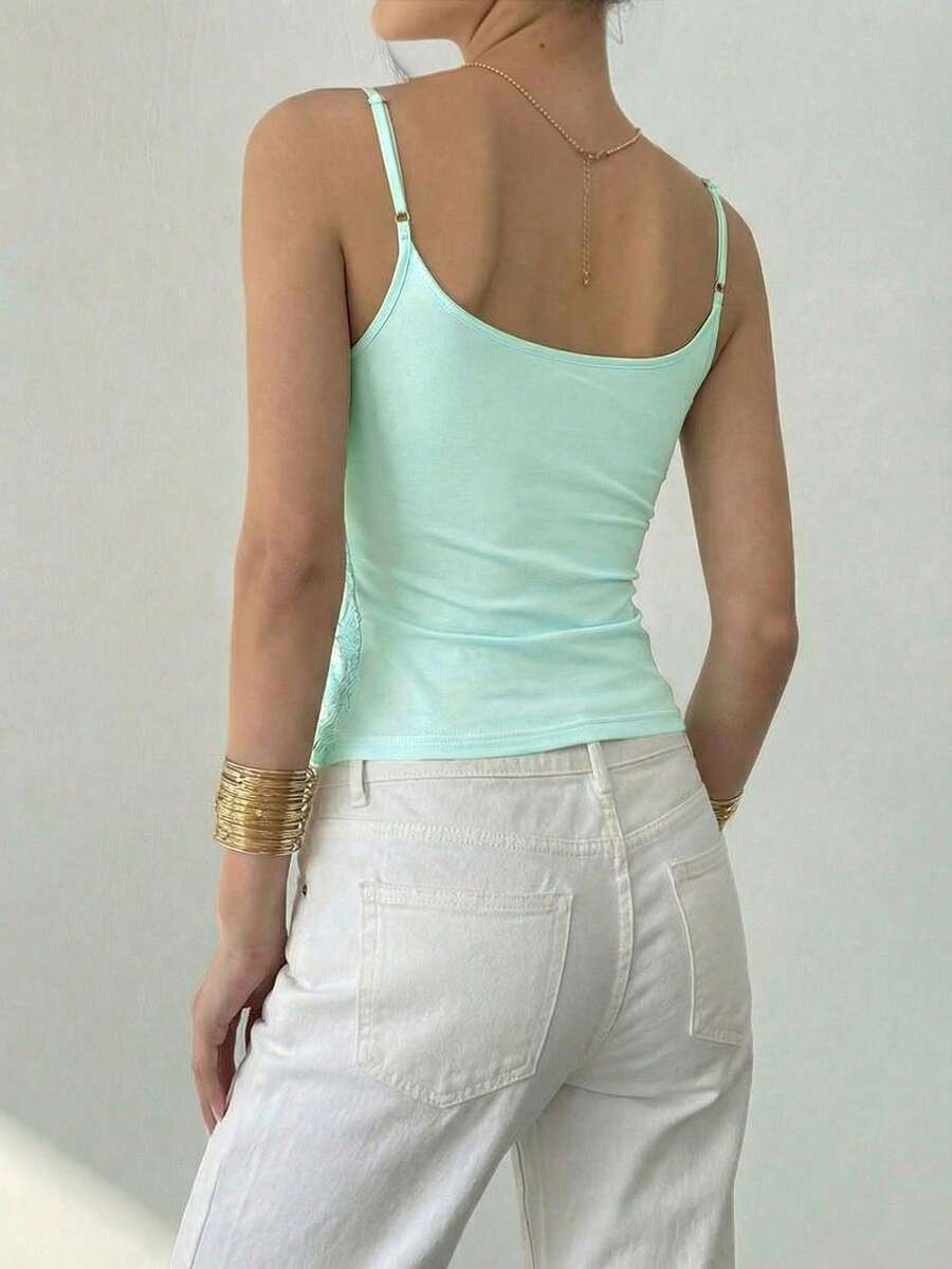 Women's sequin camisole top with spaghetti straps and a 3D rose embellishment