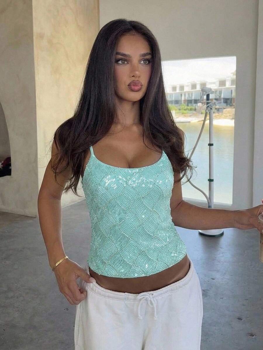 Women's sequin camisole top with spaghetti straps and a 3D rose embellishment