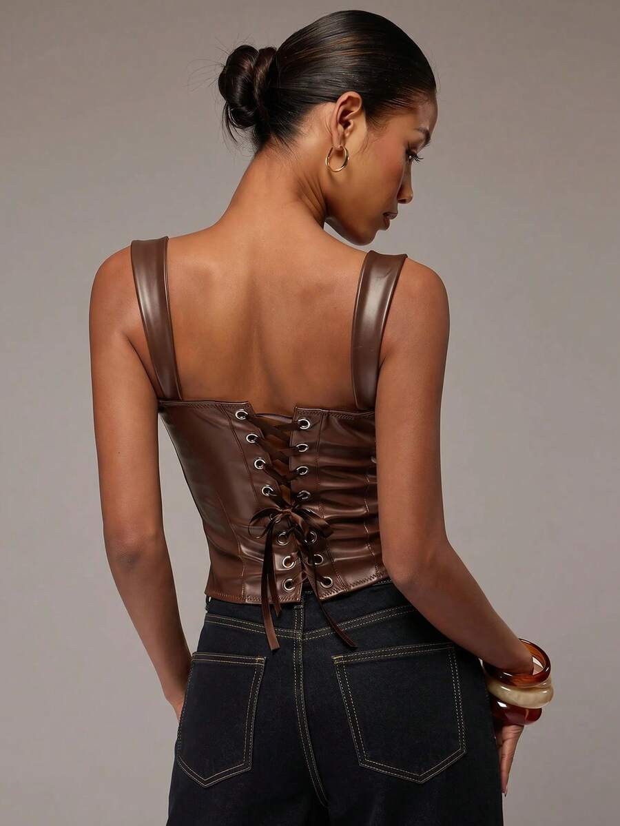 Women's slim fit tank top with rhinestone detail, wide straps, and a short length for casual beach wear.