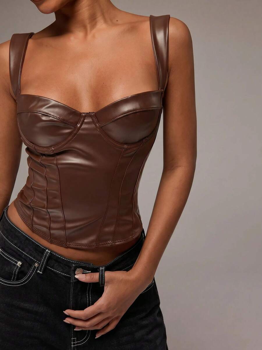 Women's slim fit tank top with rhinestone detail, wide straps, and a short length for casual beach wear.