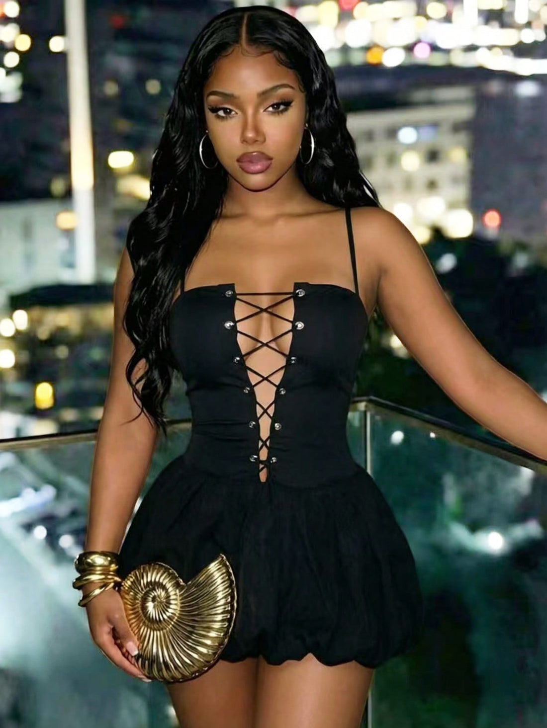 BamGlam women's black mini cami dress featuring a deep V-neckline with hollowed-out crisscross straps, spaghetti straps, and a flared hem.