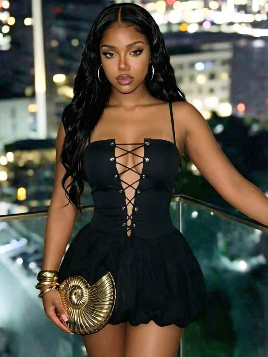 BamGlam women's black mini cami dress featuring a deep V-neckline with hollowed-out crisscross straps, spaghetti straps, and a flared hem.