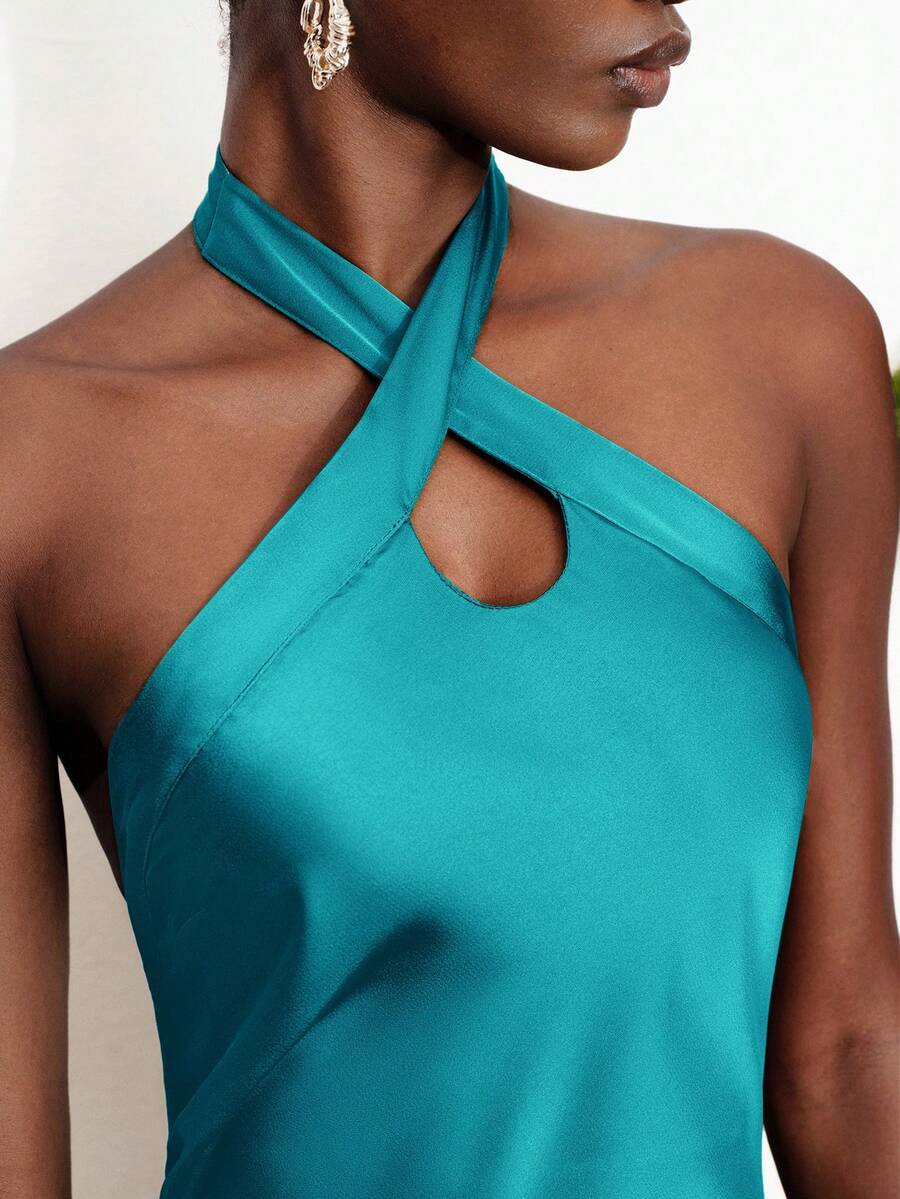 Women's black satin halter neck bodycon midi dress featuring a sleeveless backless design with front slit hem and wrap details.