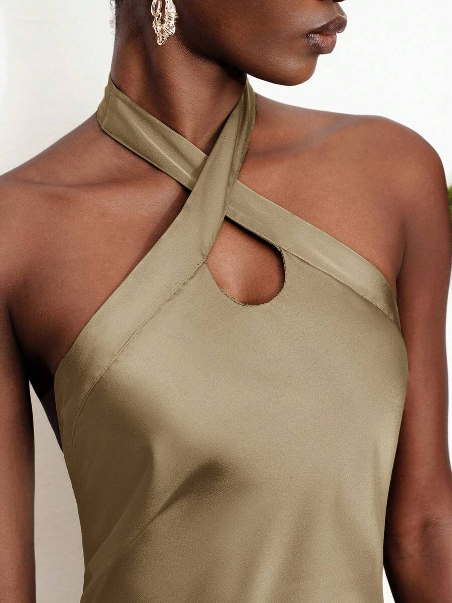 Women's black satin halter neck bodycon midi dress featuring a sleeveless backless design with front slit hem and wrap details.