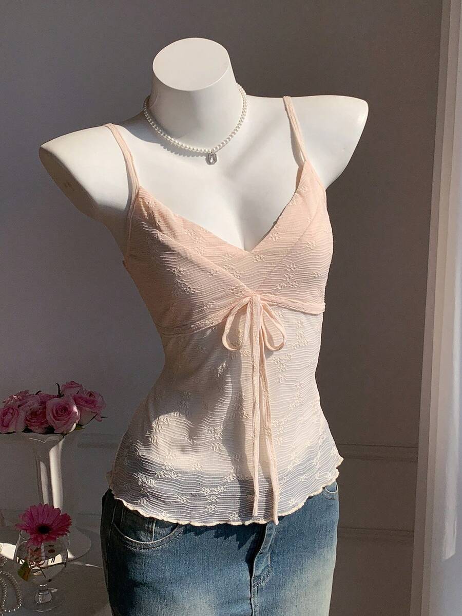 Black and white polka dot tie strap camisole top for women with thin spaghetti straps and slim fit.