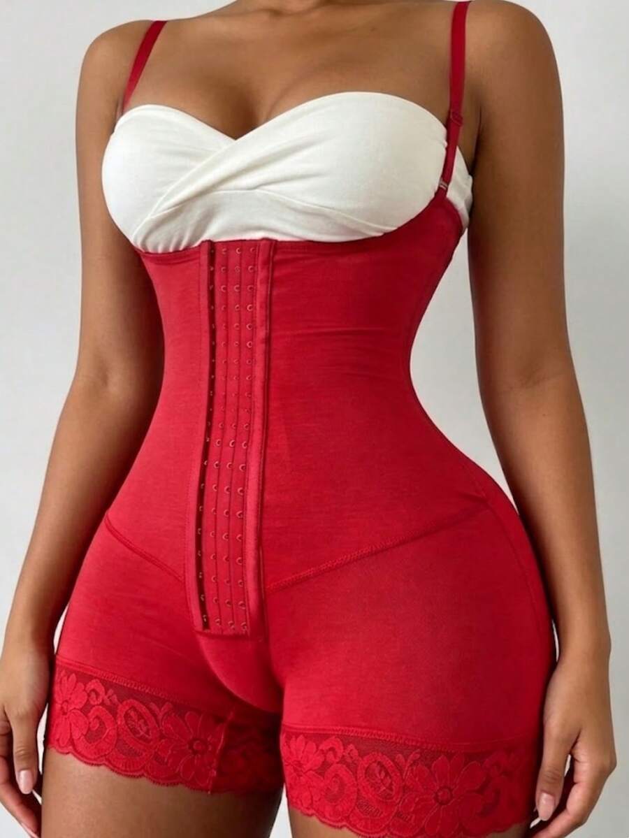 Women's apricot body shaper jumpsuit with 4-row hook and eye front closure and contrast lace details.