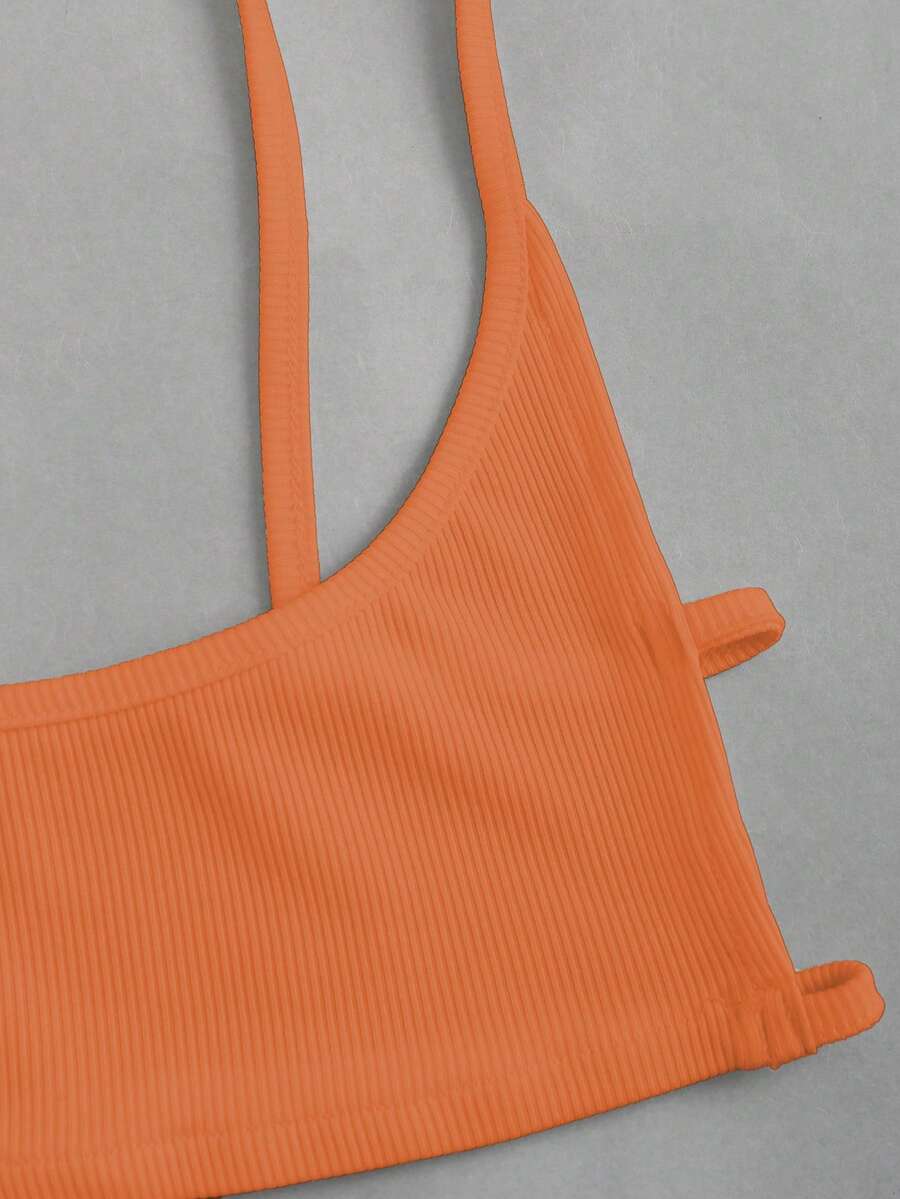 Women's black cropped camisole top with faux crocodile texture, backless spaghetti straps, and matching arm sleeves.